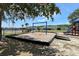 Community playground with swingset and slide with many houses in the neighborhood nearby at 1043 Tourmaline Dr, Kissimmee, FL 34746