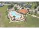 Beautiful community pool featuring unique design and seating, plus a playground and recreation area at 1043 Tourmaline Dr, Kissimmee, FL 34746