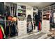 Spacious walk-in closet with custom shelving, drawers, and ample hanging space for organized storage at 1043 Tourmaline Dr, Kissimmee, FL 34746