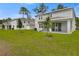 A spacious backyard with a covered patio, perfect for outdoor living at 1051 Cloud Ridge Ct, Mount Dora, FL 32757