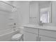 Clean bathroom with white vanity, quartz countertop, and shower-tub combo at 1051 Cloud Ridge Ct, Mount Dora, FL 32757