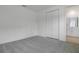 Well-lit bedroom features a closet and adjacent bathroom entrance at 1051 Cloud Ridge Ct, Mount Dora, FL 32757