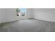 Bright bedroom with ample windows and neutral walls with plush carpeting at 1051 Cloud Ridge Ct, Mount Dora, FL 32757