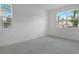 Serene bedroom featuring tile floors, recessed lighting, and large windows providing natural light and outdoor views at 1051 Cloud Ridge Ct, Mount Dora, FL 32757