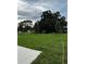 Large backyard with lush greenery and fresh sod at 1053 Waterfall Blvd, Davenport, FL 33837