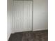 Neutral colored closet with bi-fold doors and a functional storage solution at 1053 Waterfall Blvd, Davenport, FL 33837