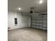 Functional two car garage, painted, with interior lighting and garage door opener at 1053 Waterfall Blvd, Davenport, FL 33837
