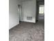 Spacious living room offers neutral paint, carpeting, and ample space for furnishings and decor to suit any style at 1053 Waterfall Blvd, Davenport, FL 33837