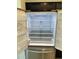 Interior view of a stainless steel LG refrigerator with shelving and door storage at 1053 Waterfall Blvd, Davenport, FL 33837