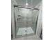 Stylish shower is encased in glass and tile, featuring modern fixtures and a sleek design, enhancing your bathing experience at 1053 Waterfall Blvd, Davenport, FL 33837