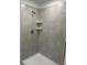 Modern shower is beautifully tiled, featuring contemporary fixtures and a sleek design, creating a spa-like experience at 1053 Waterfall Blvd, Davenport, FL 33837