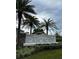 Cascades community entrance sign surrounded by palm trees and lush landscaping at 1053 Waterfall Blvd, Davenport, FL 33837