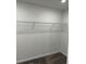 Spacious walk-in closet with wire shelving provides ample storage at 1053 Waterfall Blvd, Davenport, FL 33837