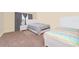 A spacious bedroom features carpet and two beds with stylish comforters at 10733 Savannah Landing Cir, Orlando, FL 32832