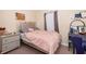 A charming bedroom features a silver bed frame, nightstand, and decor at 10733 Savannah Landing Cir, Orlando, FL 32832