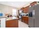 Kitchen featuring granite countertops, stainless steel appliances, breakfast bar, and neutral finishes at 10733 Savannah Landing Cir, Orlando, FL 32832
