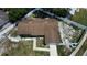 Aerial view of a single story home featuring a fenced yard and mature trees surrounding the property at 114 N Alderwood St, Winter Springs, FL 32708