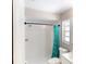 Well-lit bathroom featuring a shower with decorative curtain and a white vanity at 114 N Alderwood St, Winter Springs, FL 32708