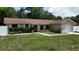 Charming one story home with a one-car attached garage and arched entryway at 114 N Alderwood St, Winter Springs, FL 32708