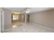 Open living space with tile flooring, with view to dining area at 114 N Alderwood St, Winter Springs, FL 32708