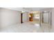 Spacious living room with tile flooring, flowing to dining area and kitchen at 114 N Alderwood St, Winter Springs, FL 32708