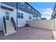 Private backyard patio with a paver surface, steps to the building and a fenced perimeter at 12190 Plumpton Dr, Winter Garden, FL 34787