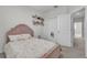 Comfortable bedroom with a plush bed, closet, and playful decor at 12190 Plumpton Dr, Winter Garden, FL 34787