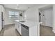 Bright kitchen features a large island with stainless steel appliances and a window at 12190 Plumpton Dr, Winter Garden, FL 34787