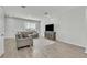 Comfortable living room features neutral tones, modern furniture, and wood-look flooring at 12190 Plumpton Dr, Winter Garden, FL 34787