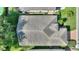 Birds-eye view of the roof, landscaping, and neighboring houses, showcasing its location in a residential area at 124 Ashton Dr, Davenport, FL 33837