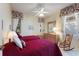 Bright bedroom with two twin beds, floral valances, and dresser with mirror at 124 Ashton Dr, Davenport, FL 33837