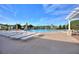 Large community pool with blue water, lounge chairs and ample sunlight for relaxation and enjoyment at 124 Ashton Dr, Davenport, FL 33837