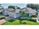 Charming home with brick driveway, well-maintained lawn, and mature landscaping at 124 Ashton Dr, Davenport, FL 33837