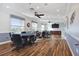 Game room featuring tables, chairs, wood floors, neutral paint, ceiling fans, and a large television at 124 Ashton Dr, Davenport, FL 33837