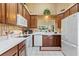 Well-lit kitchen features ample cabinet space, white appliances, and a large window at 124 Ashton Dr, Davenport, FL 33837