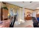 Spacious living room featuring neutral walls, carpet, and view of lanai and dining space at 124 Ashton Dr, Davenport, FL 33837