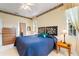 Bright main bedroom features plush carpeting, wallpaper accents, and standard closet at 124 Ashton Dr, Davenport, FL 33837
