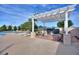 Outdoor kitchen with covered grills, seating, and serene views for social gatherings at 124 Ashton Dr, Davenport, FL 33837