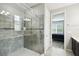 Beautiful bathroom featuring tiled shower with seamless glass door and view into bedroom at 1272 Bonita Canyon Dr, Poinciana, FL 34759