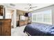 Bright bedroom featuring a wood accent wall and large window at 1272 Bonita Canyon Dr, Poinciana, FL 34759