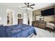 Spacious bedroom with wood accent wall and ensuite bathroom at 1272 Bonita Canyon Dr, Poinciana, FL 34759