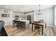 Bright kitchen with a center island, stainless steel appliances, and dining area at 1272 Bonita Canyon Dr, Poinciana, FL 34759