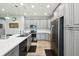 Kitchen boasting gray cabinets, stainless steel appliances and island at 1272 Bonita Canyon Dr, Poinciana, FL 34759