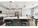 Modern kitchen featuring a center island with barstool seating at 1272 Bonita Canyon Dr, Poinciana, FL 34759