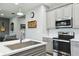 Modern kitchen showcasing stainless steel appliances, sleek countertops, and ample cabinet space at 1272 Bonita Canyon Dr, Poinciana, FL 34759