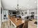 Open concept living space with wood floors and a kitchen island at 1272 Bonita Canyon Dr, Poinciana, FL 34759