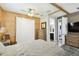 Spacious main bedroom showcasing an ensuite entrance, wood paneling and a large closet at 1272 Bonita Canyon Dr, Poinciana, FL 34759