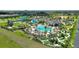 Resort-style community features a large pool, miniature golf, playground, and tiki bar for residents at 1300 Island Green St, Davenport, FL 33896