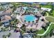 Amazing view of the large community pool with many lounge chairs and palm trees for residents at 1300 Island Green St, Davenport, FL 33896