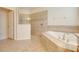 Luxury bathroom showing soaking tub and a seamless glass shower at 1300 Island Green St, Davenport, FL 33896